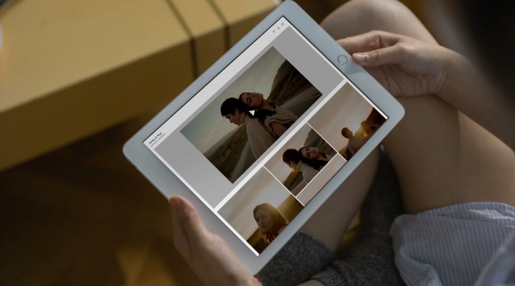 Person holding white iPad, showcasing a gallery with self-hosted video and a grid of images