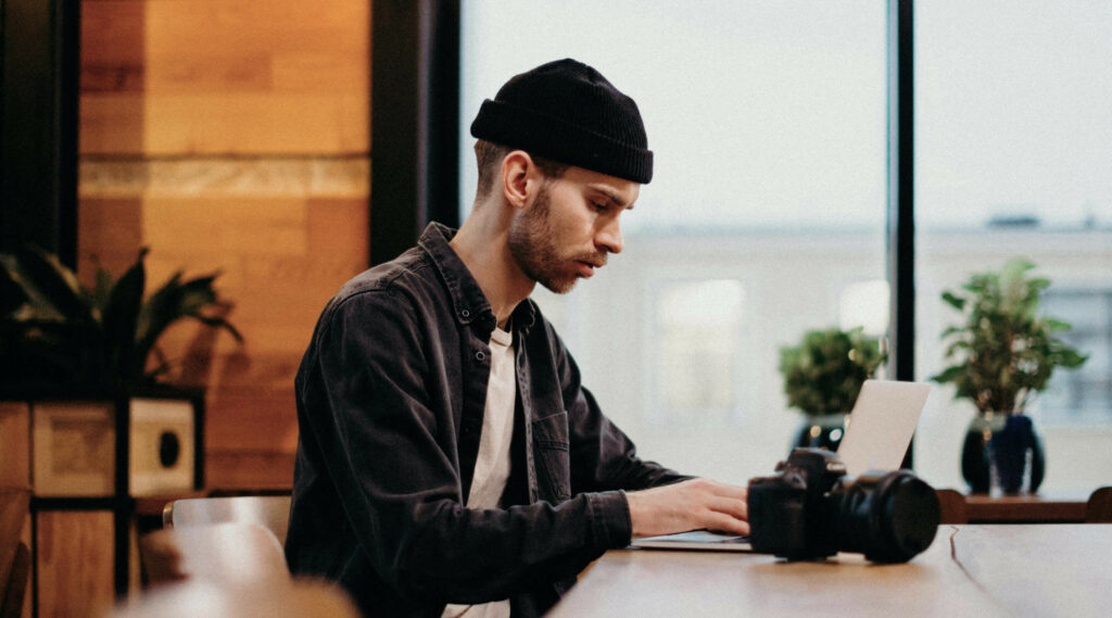 Photographer working on a photo gallery on the computer 